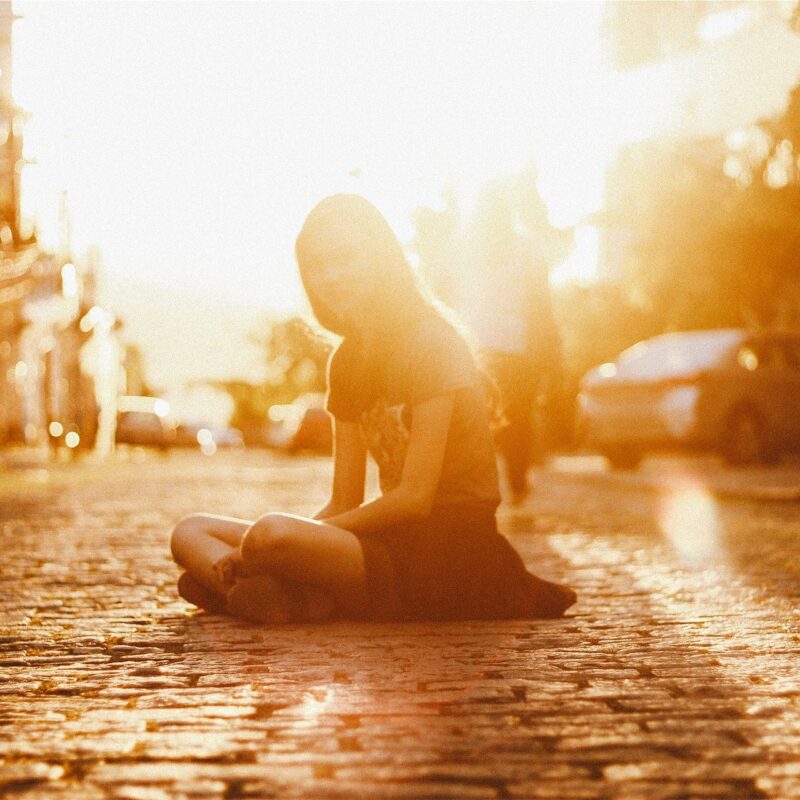 Girl on Cobblestone Street
